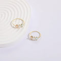Geometric copper ring with a horse eye motif and tricolour zircon stone, electroplated in 14K Real Gold RG9066 colour.