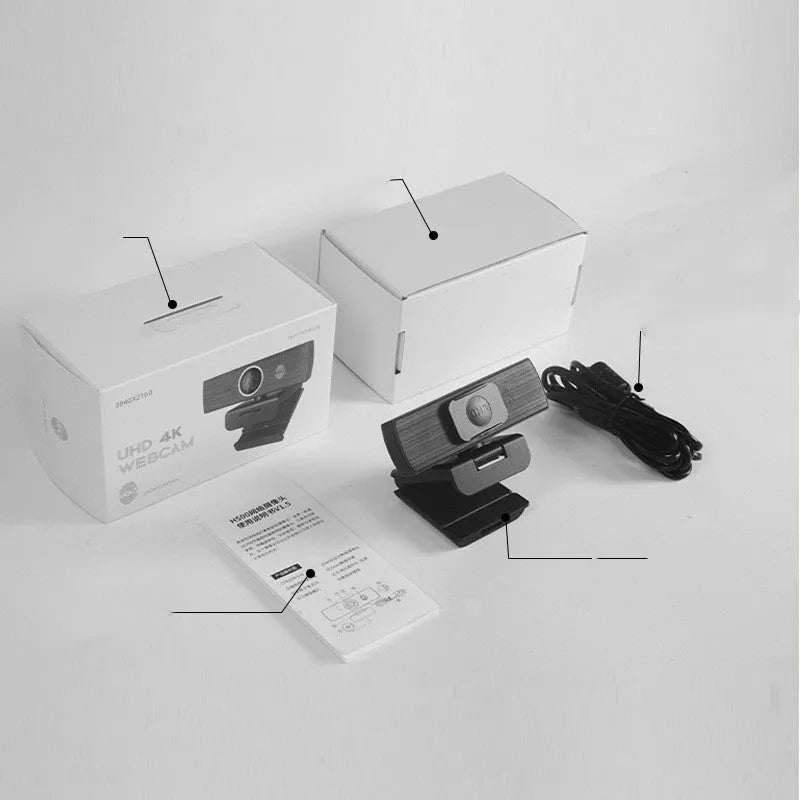 Black USB webcam with magnetic privacy cover on a desk, showing 1.7m cable.