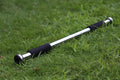 Steel adjustable indoor pull-up bar extended to fit within a door frame.