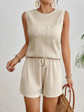 Women's apricot polyester sleeveless vest and matching shorts set on a hanger.