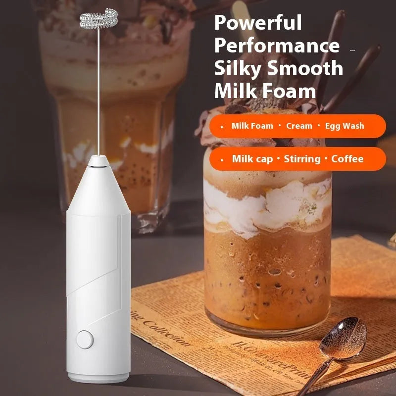 Mini handheld electric milk frother with stainless steel whisk in black, white, and khaki colour options.