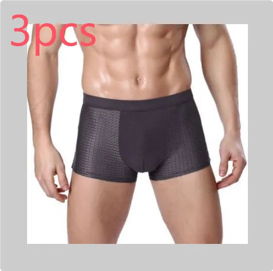 Men's solid colour modal boxer briefs with a U convex design on a mid-waist.