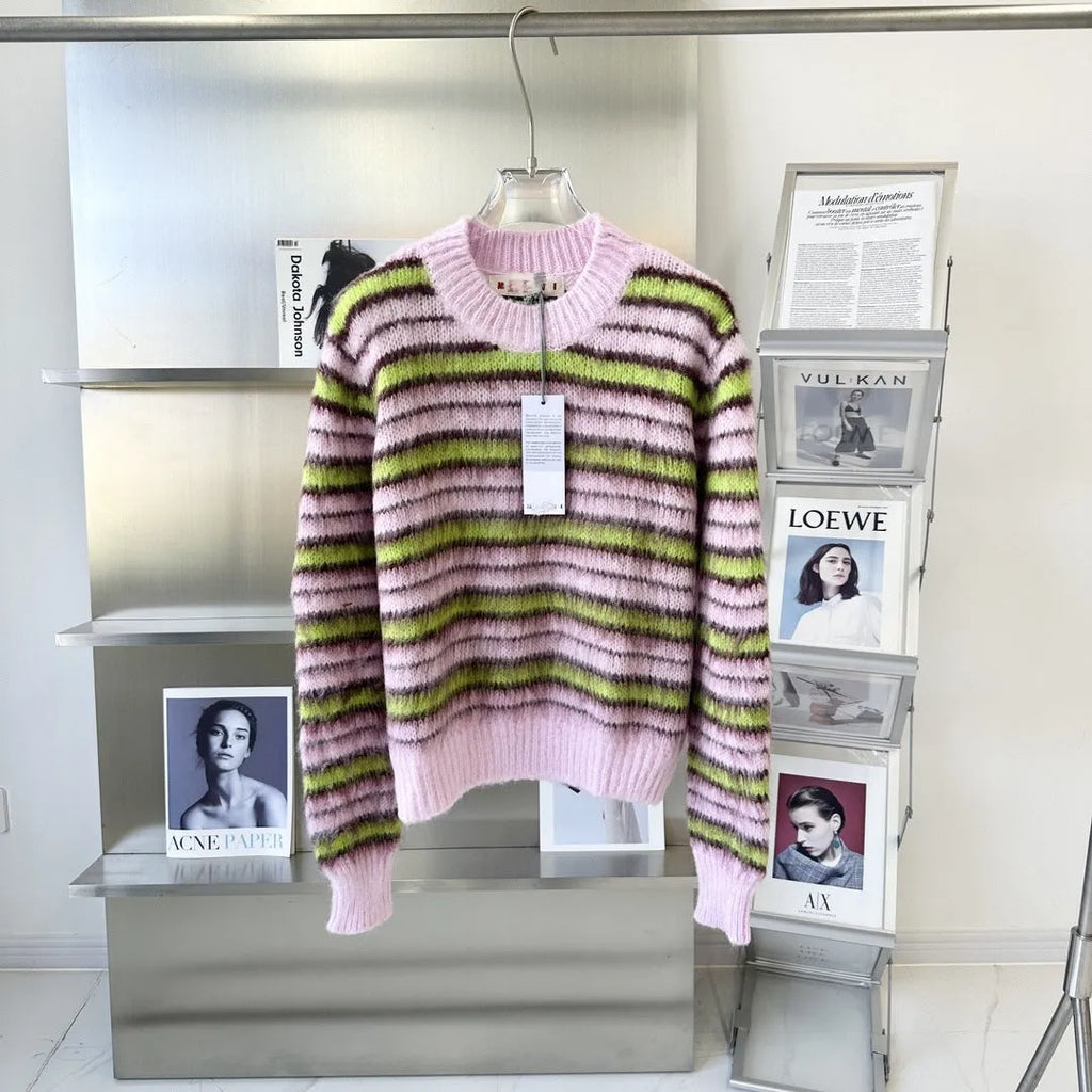 Pink wool knitted cardigan sweater with round collar on a hanger