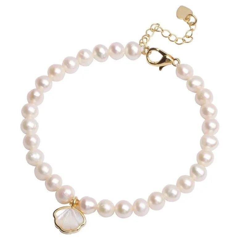 Freshwater pearl bracelet with fan-shaped pearl arrangement showing elastic string and extension chain fastening options