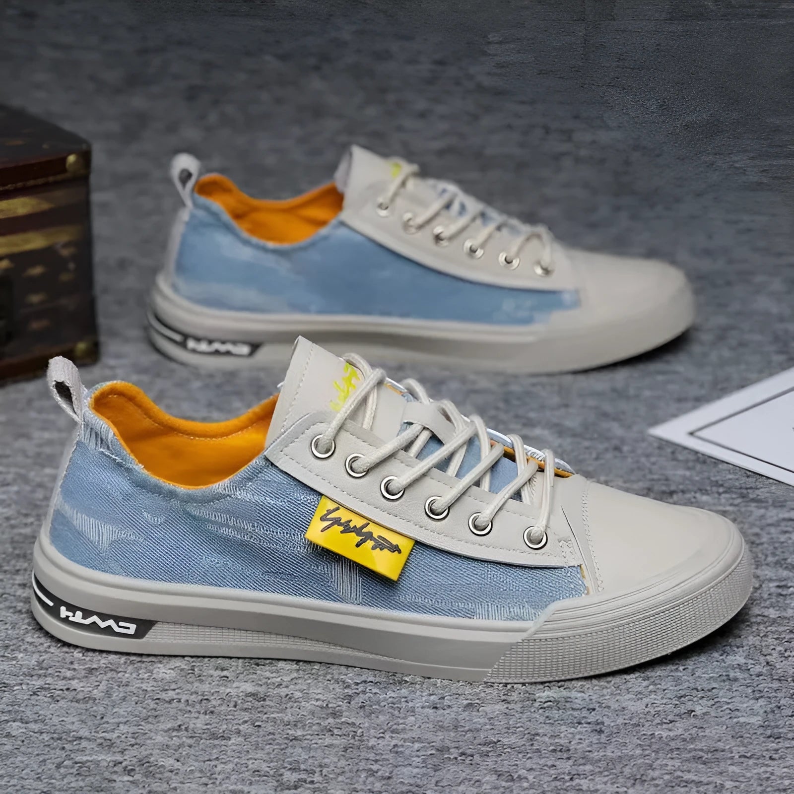 A pair of men's casual canvas lace-up shoes with a round toe and rubber sole.