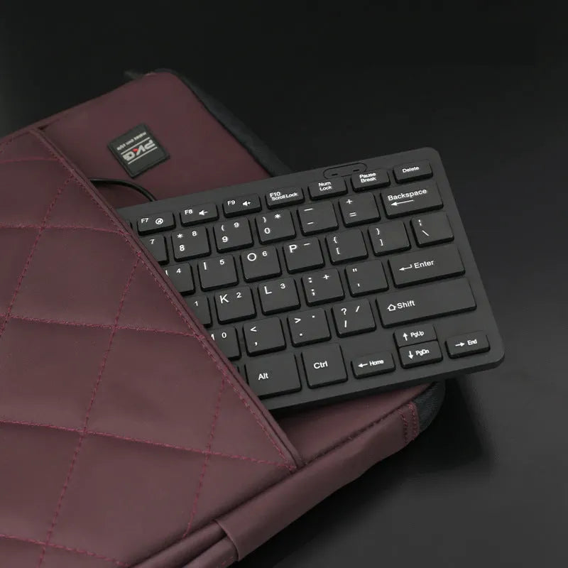 USB wired mini keyboard in four colours: black, white, pink, blue with compact design