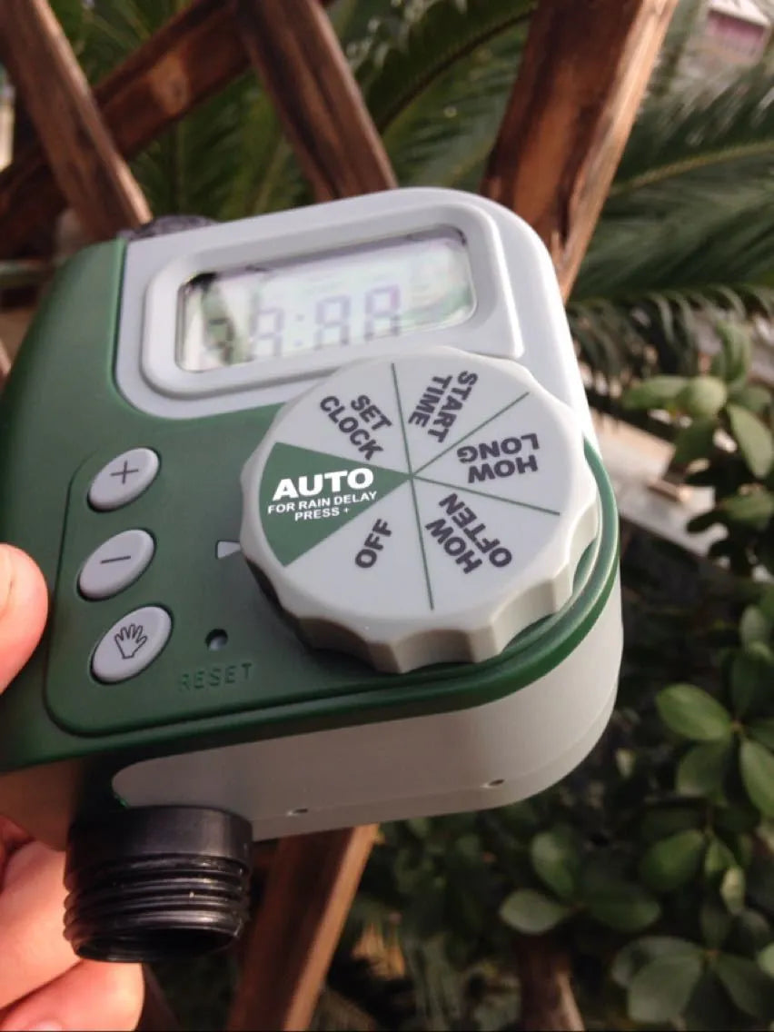 Green programmable digital garden hose faucet timer with large display and copper connector