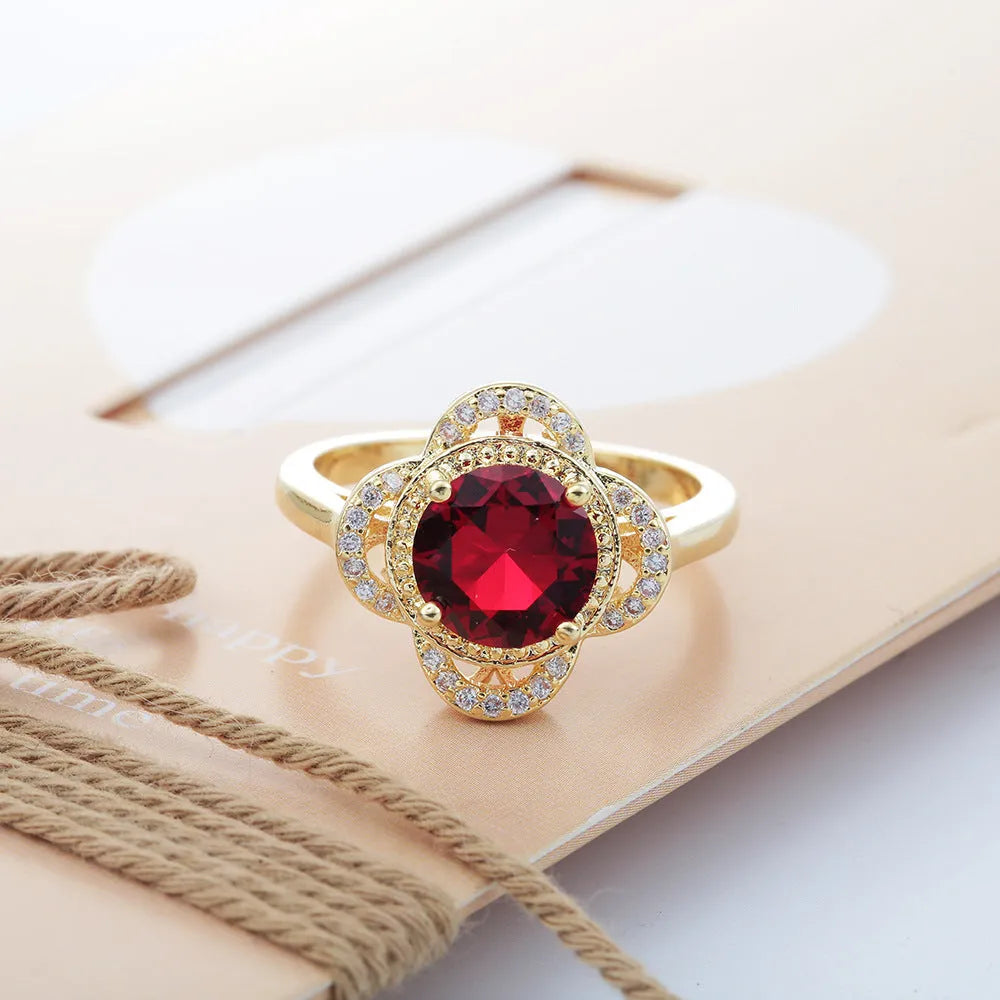 Copper ring with gold-tone electroplated finish featuring zircon stone fruit design