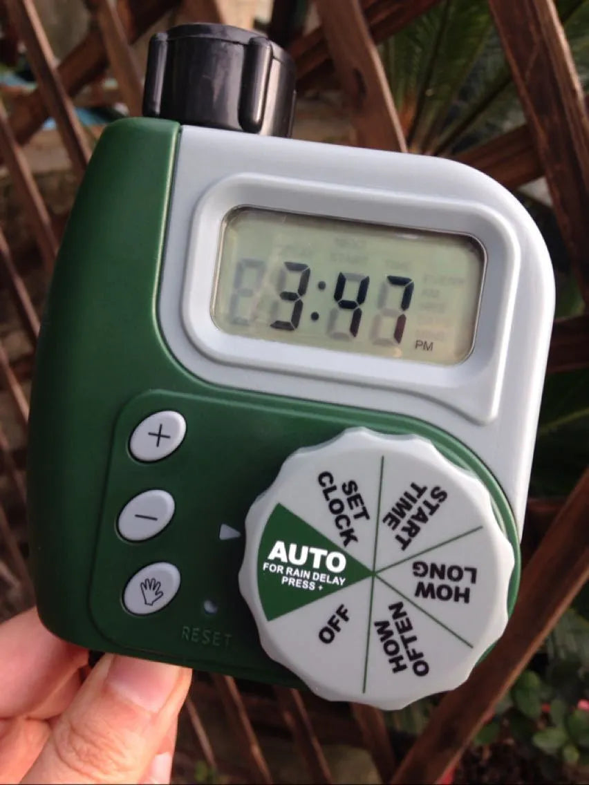 Green programmable digital garden hose faucet timer with large display and copper connector