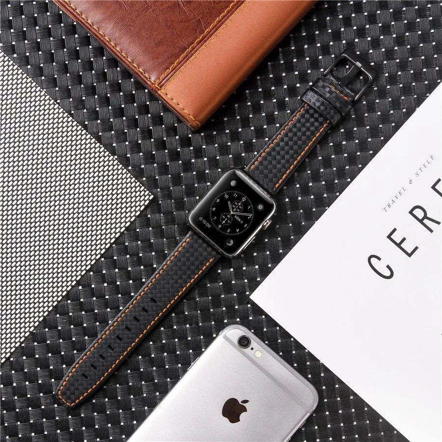 Carbon fibre and leather Apple Watch strap on a PC hard shell case, showing red, black, orange, and blue colour options.