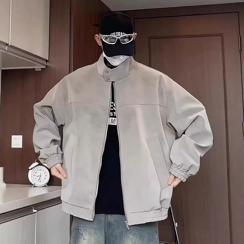 Grey tie-dye PU leather jacket with a stand collar and side pockets on a male model.