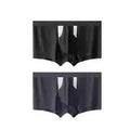 Men's black ice silk double-layer underwear shorts on a grey background.