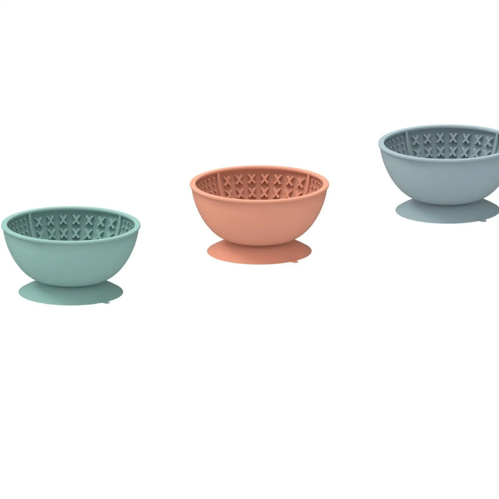 Blue silicone pet slow feeder bowl with textured lick mat surface and suction cup base