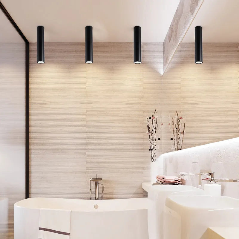 Round black surface-mounted LED ceiling downlight spotlight in modern style.