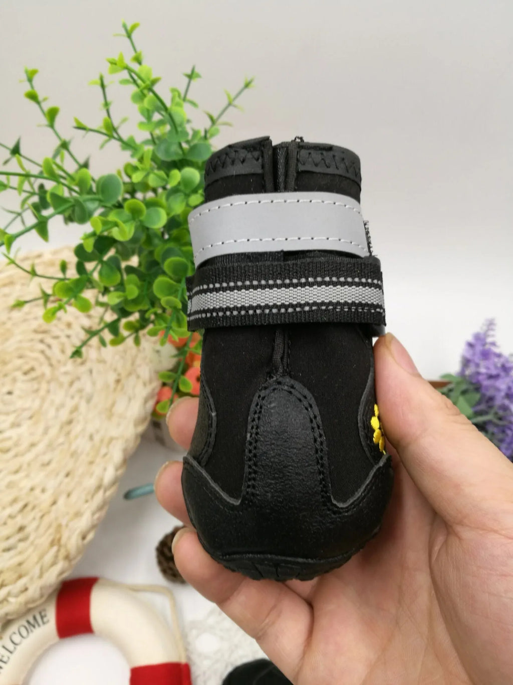 Black waterproof dog shoes with non-slip PVC sole, adjustable fuzzy belt