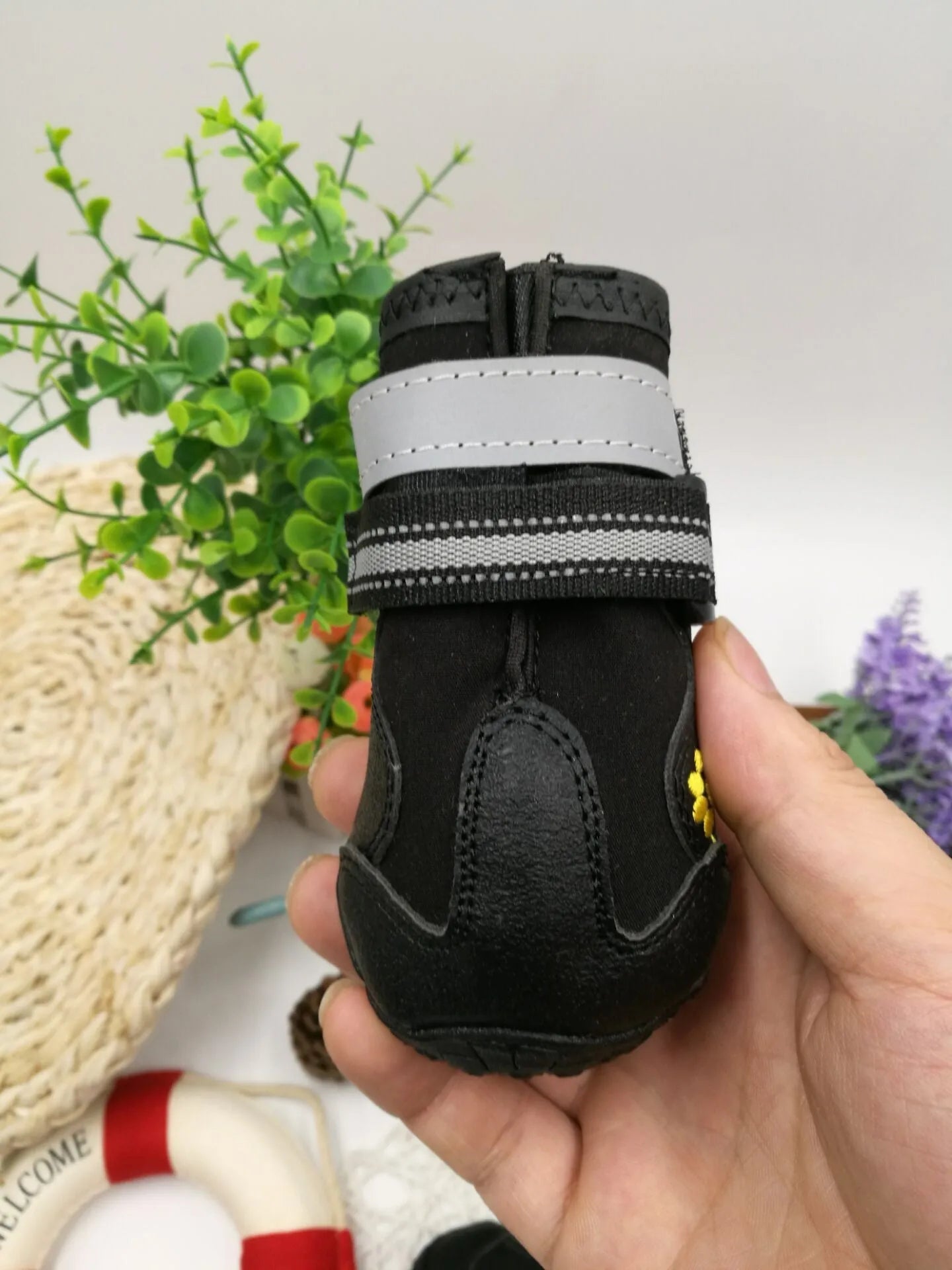 Black waterproof dog shoes with non-slip PVC sole, adjustable fuzzy belt