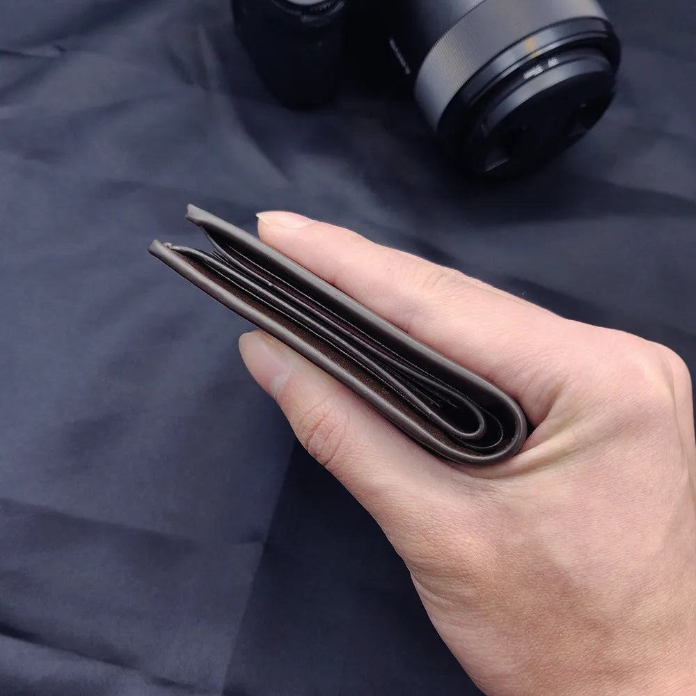 Men's classic leather zip-around wallet, presented as a gift.
