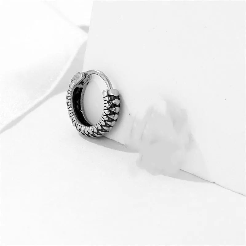 Silver geometric retro twist earrings made from titanium steel alloy with stripe detailing.