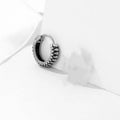 Silver geometric retro twist earrings made from titanium steel alloy with stripe detailing.