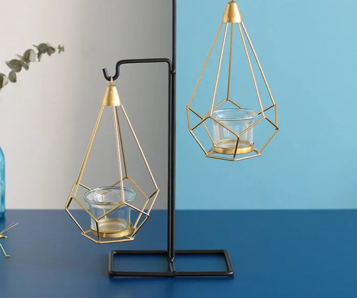 Set of six Nordic iron candle holders in various styles for block candles on a wooden shelf