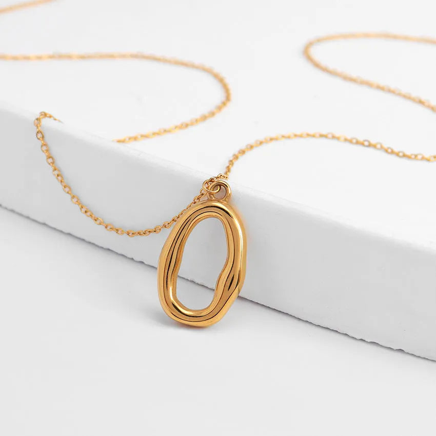 Stainless steel snake bones chain necklace with geometric glossy ring pendant in golden irregular ring finish