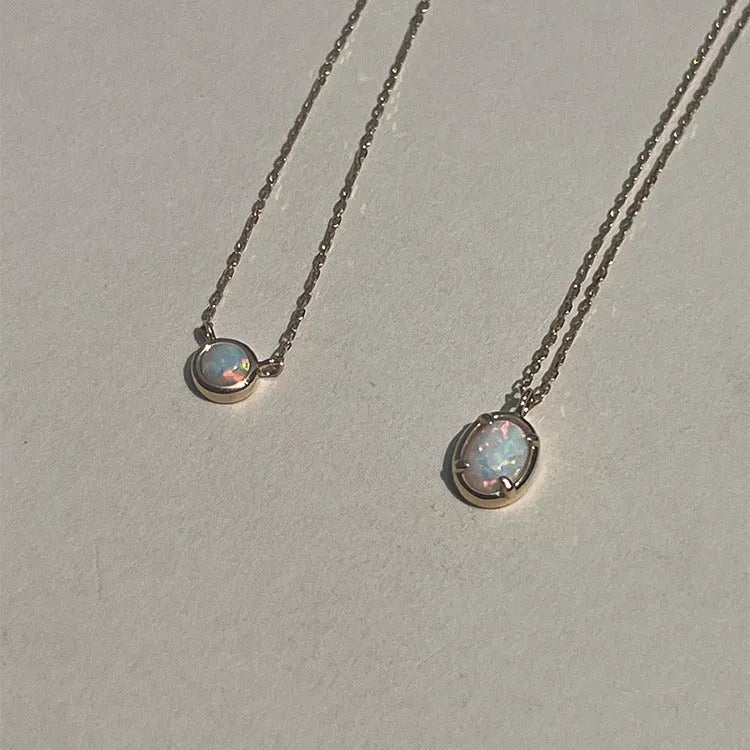 Oval geometric jelly opal pendant necklace in sterling silver with gold or white gold plating.