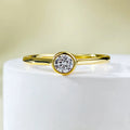 Minimalist silver crown-shaped ring with linear details in gold or platinum finish.