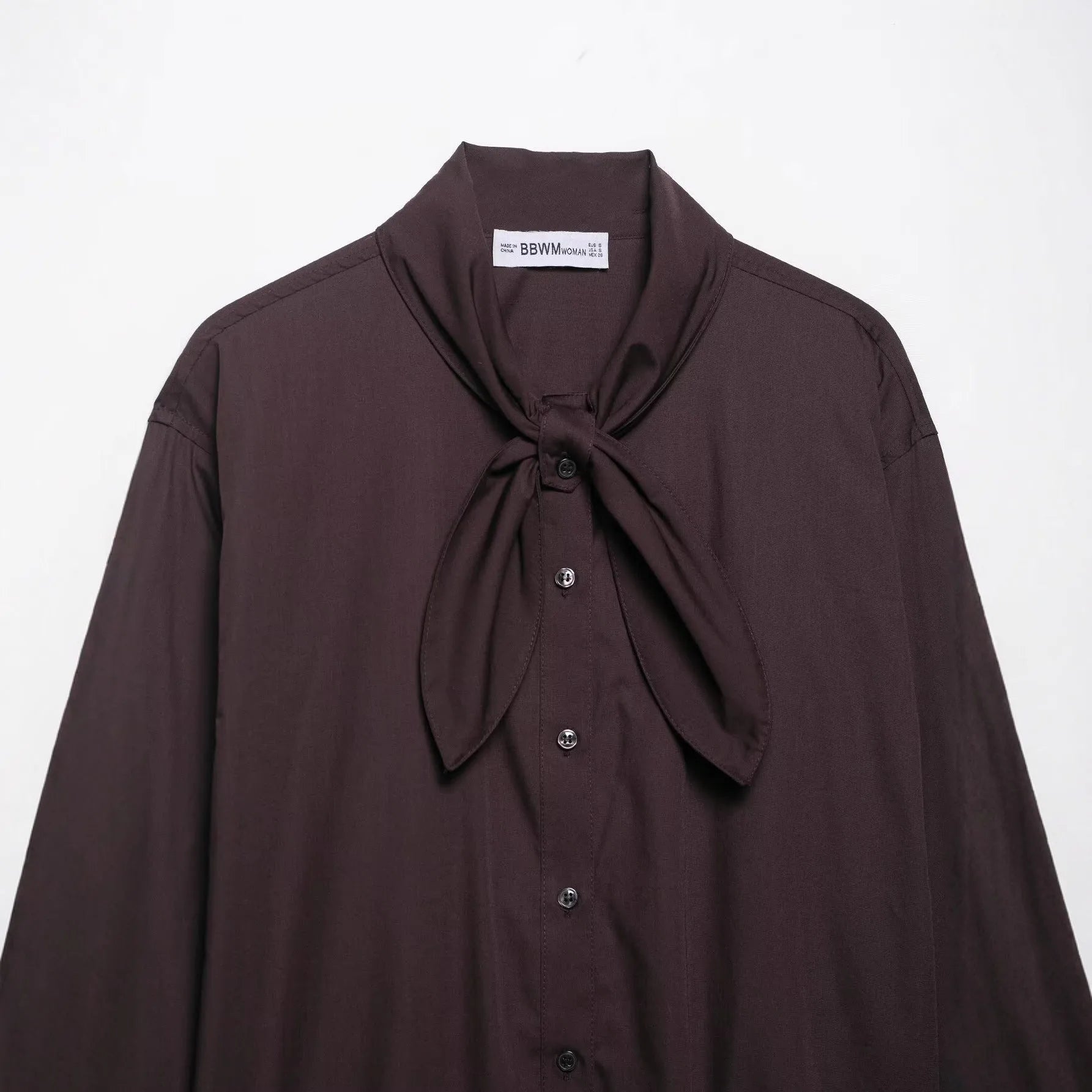 Brown women's poplin shirt with cardigan-style front and bow tie detail, long sleeves and loose fit