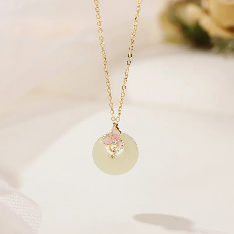 Silver orchid necklace for girls with floral geometry pendant and a secure peace buckle clasp on an O-ring chain.