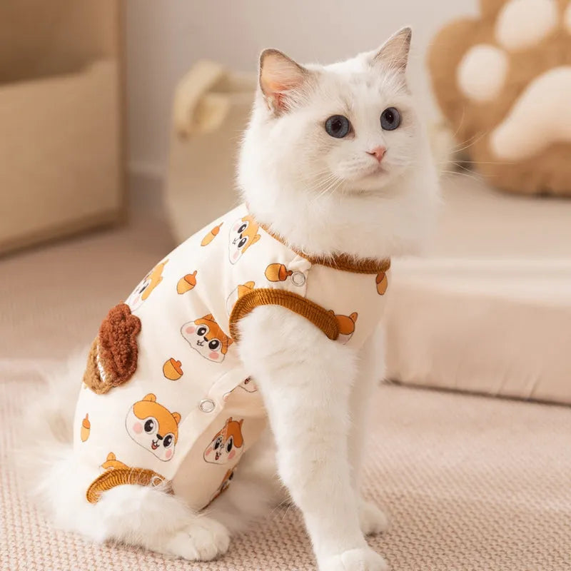 Chip 'n' Dale sleeveless dog jumpsuit with squirrel and acorn print, fuzzy embroidered acorn pocket, ribbed cuffs and snap closure, cream or white.