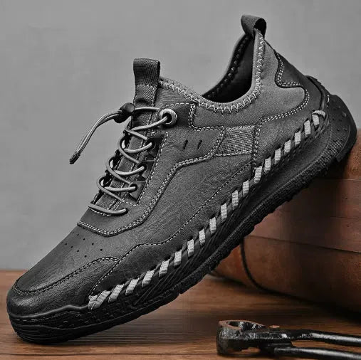 Men's hand-stitched round toe sneakers in black synthetic PU, low heel 1-3 cm, lace-up closure, side view