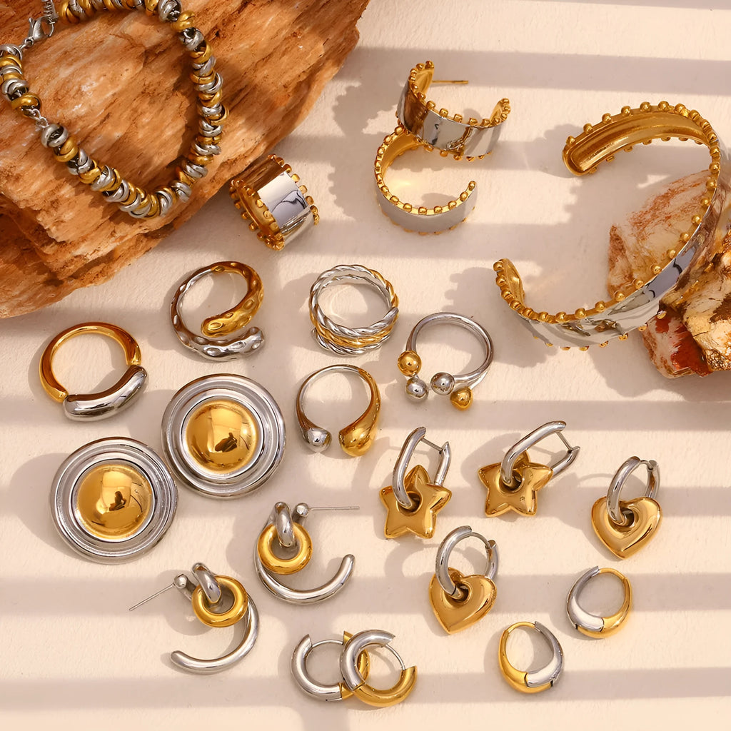 Women's stainless steel jewellery set with gold electroplated finish showing earrings, necklace and bracelet