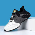 Casual low-top trainers for teenagers with thick plastic sole and mesh lining in grey and black colourway.