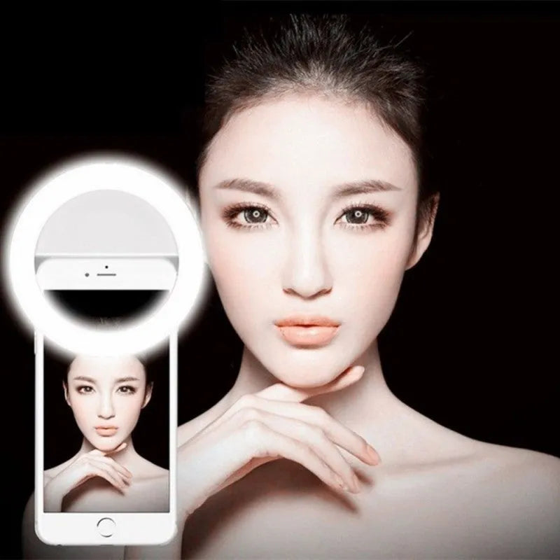 Green selfie ring light clipped onto a mobile phone with LED illumination