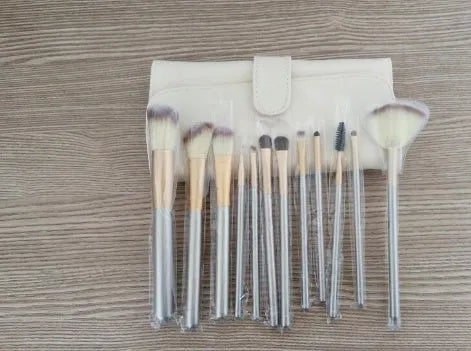 Persian make-up brush suit with rice white bristles and champagne handles arranged neatly