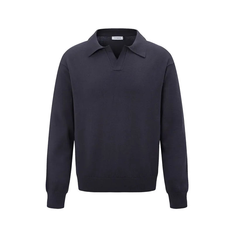 Man wearing a loose black acrylic blend pullover sweater, casual long sleeve knit top.