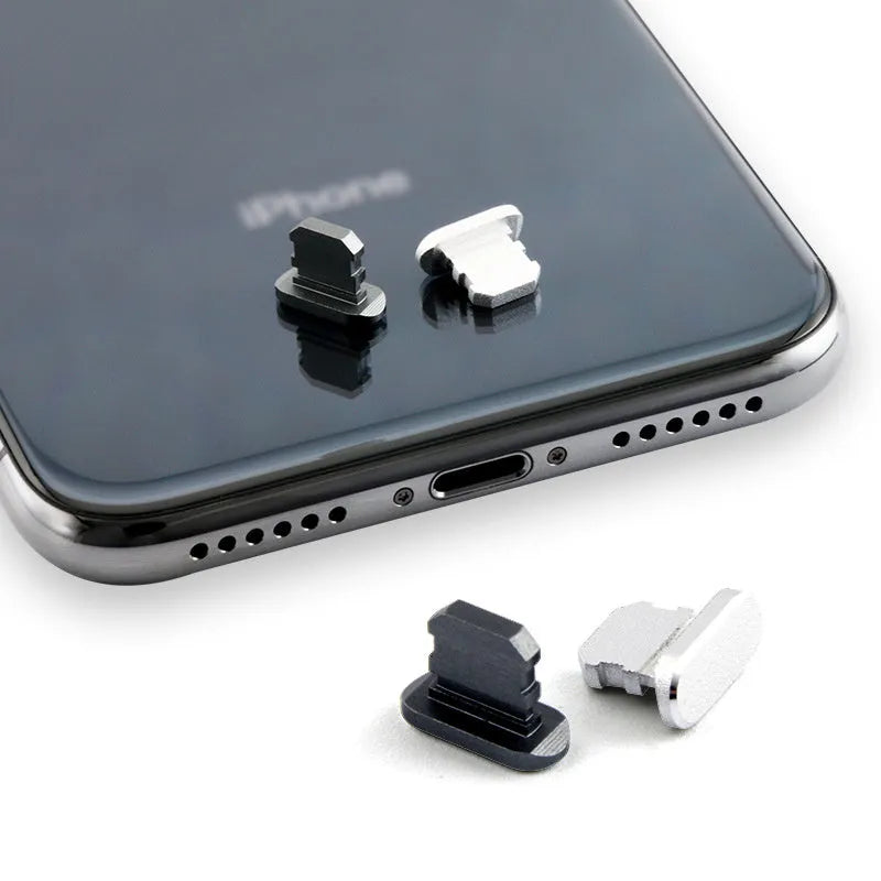 Aluminium alloy iPhone charging port dust plug in various colours including gold, silver, blue, and rose gold.