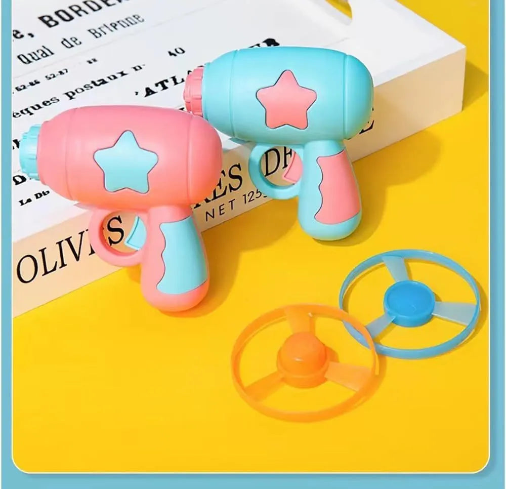 Blue plastic cat toy gun with spinning Frisbee disc for indoor cat play