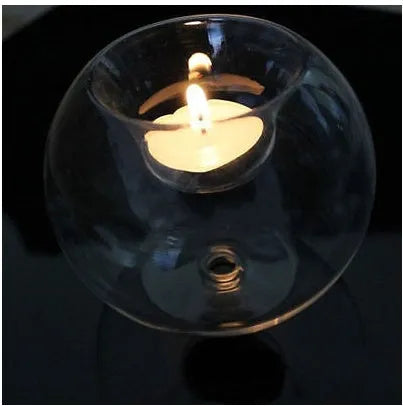 Clear round hollow handmade glass candle holder in European style on a table