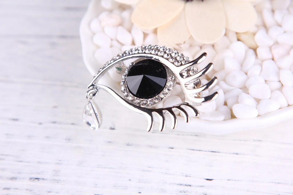 Teardrop rhinestone brooch pin alloy gold electroplated unisex totem style