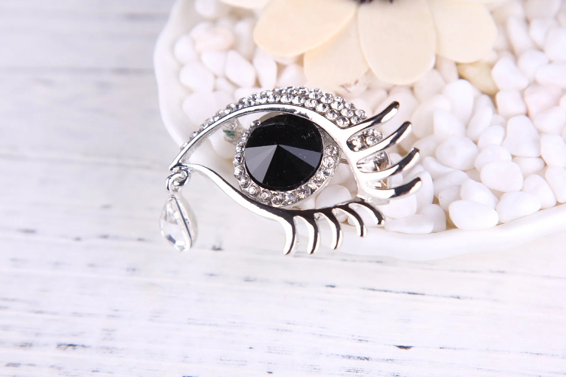 Teardrop rhinestone brooch pin alloy gold electroplated unisex totem style