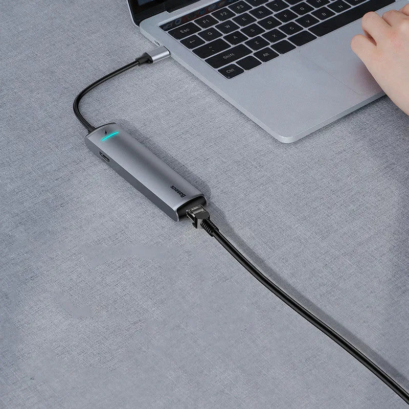 Dark grey Type-C docking station with mechanical eye design compatible with Apple MacBook and iPhone