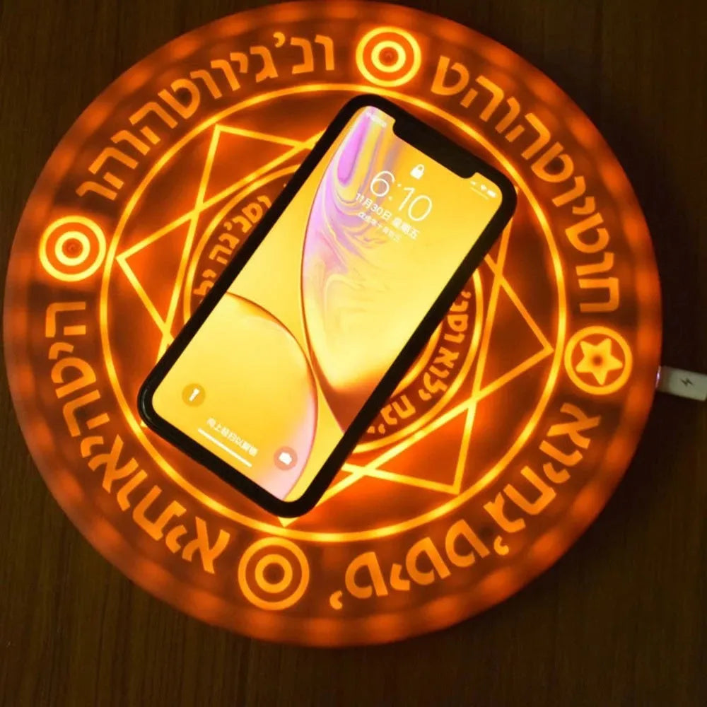Square black wireless charging pad with glowing geometric pattern for Qi-compatible phones