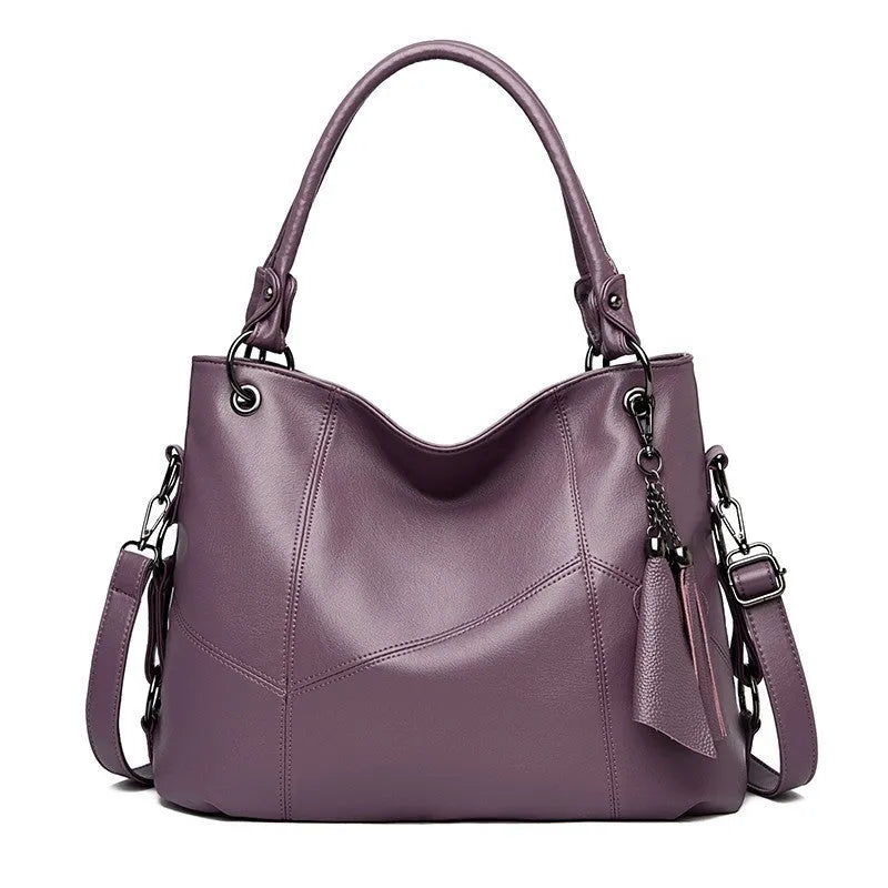 Large capacity PU tassel handbag in black, front view with tassel detail