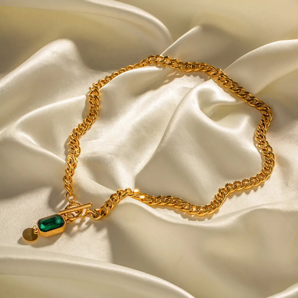 Gold geometric round pendant necklace on Cuban link chain with French retro styling