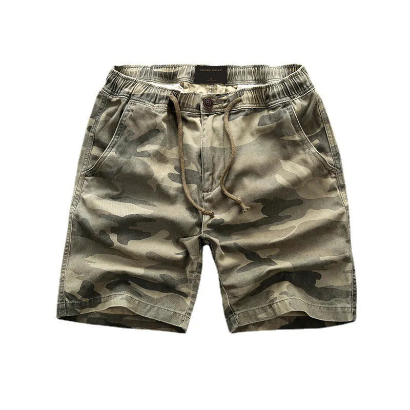 Men's green camouflage cotton workwear shorts with zip fly on a mid waist.
