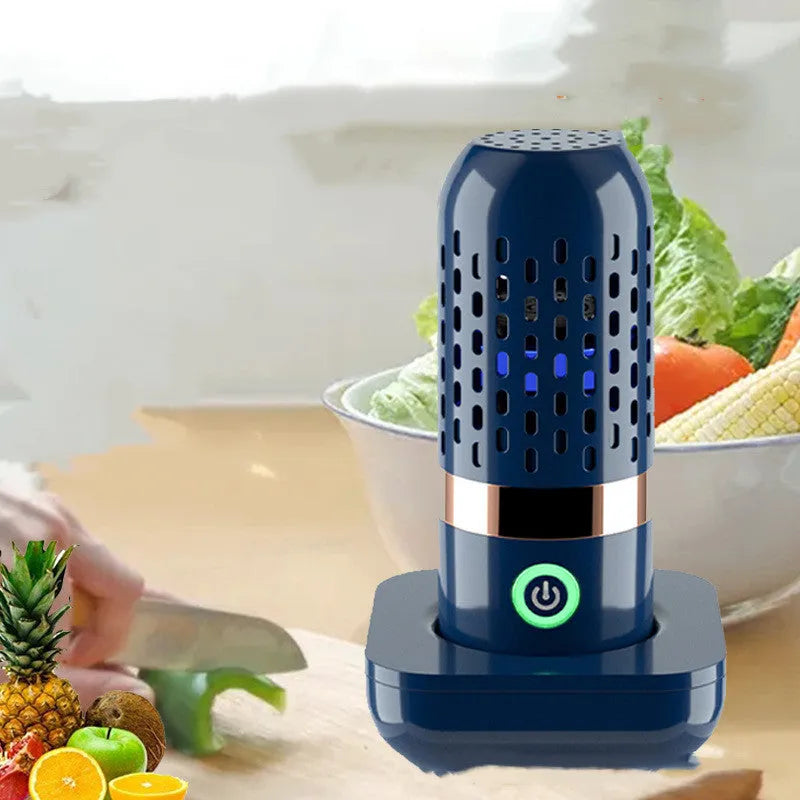 Blue capsule fruit and vegetable purifier with USB charger on a kitchen countertop