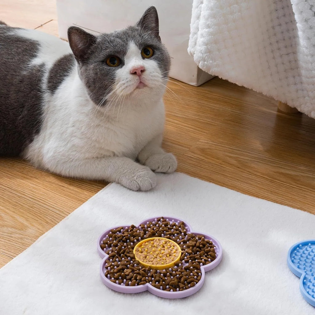 Flower-shaped silicone pet lick mat with suction cups on the base, shown in a choice of colours.