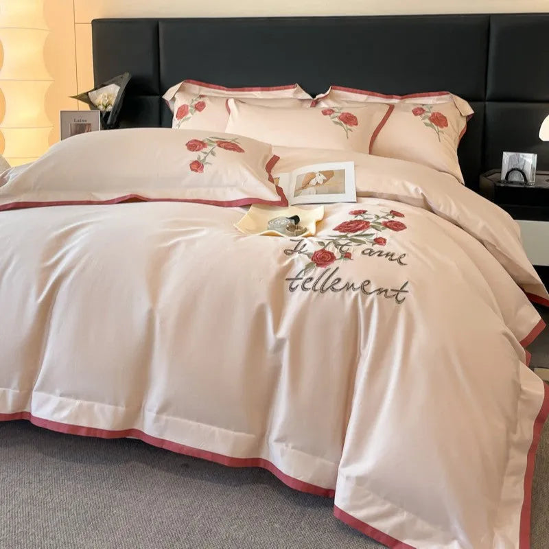 Cotton four-piece bedding set in solid colour with embroidery, includes quilt cover, bed sheet, and pillowcases