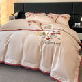 Cotton four-piece bedding set in solid colour with embroidery, includes quilt cover, bed sheet, and pillowcases